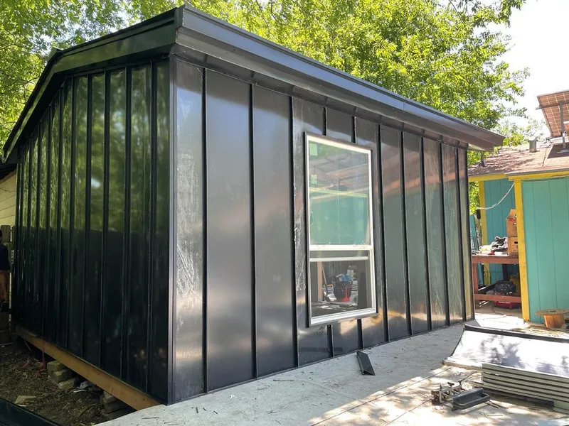 Black standing seam metal wall panels for Roof Inspection in Verde Village