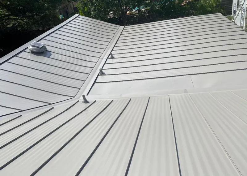Solar attic fan installed on a metal roof for Roof Ventilation in Verde Village